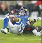  ?? Associated Press ?? Rams quarterbac­k Matthew Stafford (9) is sacked by Tampa Bay Buccaneers defensive tackle Rakeem Nunez-Roches during the second half, Sunday, in Tampa, Fla. The Rams lost to the Buccaneers 16-13.