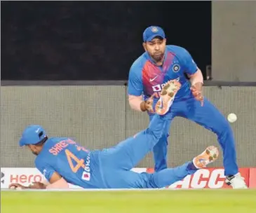  ??  ?? Rohit Sharma reacts as teammate Shreyas Iyer drops a catch from West Indies' Nicholas Pooran during the second T20I.
AP