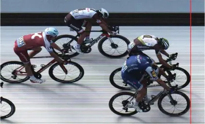  ??  ?? In this photo finish image released yesterday by A.S.O., Germany’s sprinter Marcel Kittel, bottom right, crosses the finish line ahead of Norway's Edvald Boasson Hagen, top right, Australia's Michael Matthews, top center, and Norway's Alexander Kristoff, left, to win the seventh stage of the Tour de France Photo: AP
