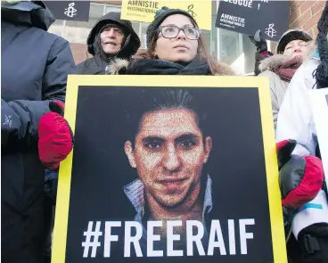  ?? RYAN REMIORZ / THE CANADIAN PRESS FILES ?? Ensaf Haidar, wife of blogger Raif Badawi, takes part in a rally for his freedom in Montreal in 2015. Badawi has been sentenced to 10 years in prison and 1,000 lashes for the crime of “insulting Islam through electronic channels.”