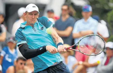  ?? /Clive Brunskill/Getty Images ?? Still determined: Kevin Anderson returns a shot during his first-round victory at the US Open over JC Aragone.