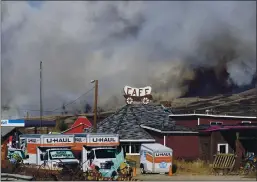  ?? DAVID ZALUBOWSKI — THE ASSOCIATED PRESS ?? Smoke rises from mountain ridges as a wildfire burns south of Highway 34 Thursday near Granby, Colotsfo.