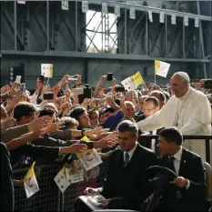 ?? AP PHOTO/ANTONIO CALANNI ?? Pope Francis arrives at the ILVA steel-making company in Genoa, Italy on Saturday. Pope Francis has begun a one-day visit to the northern Italian port city of Genoa to meet with workers, poor and homeless people, refugees and prisoners. His opened his visit at ILVA, a troubled steel-making company, where workers in hard hats awaited him. The visit puts a focus on the plight of workers whose lives have been made precarious by years of economic crisis.