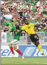  ?? (AFP) ?? Mexico’s Angel Sepulveda (left), is blocked by Jamaica’s Kemar Lawrence in their semifinal game during the 2017 CONCACAF Gold Cup at the Rose Bowl Stadium in Pasadena, California
on July 23.