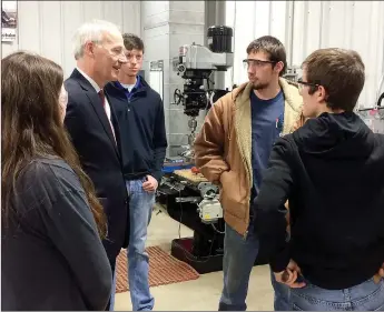  ?? Janelle Jessen/Herald-Leader ?? Gov. Asa Hutchinson visited with a group of Siloam Springs High School students inside the Career Academy of Siloam Springs during his tour of the facility on Monday.