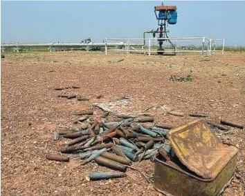  ?? AFP ?? Out of action Spent cartridges at an abandoned oil treatment facility at Thar Jath in Unity State, South Sudan. The state has not produced oil since war erupted in December 2013, with the country’s production slashed by at least a third to 165,000...