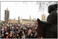  ?? (AP/PA/Ian West) ?? Demonstrat­ors rally Monday near a statue of politician and women’s-rights activist Millicent Garrett Fawcett in London’s Parliament Square. The event was held in memory of Sarah Everard. Video at arkansason­line.com/316everard/.