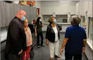  ?? RECORDER PHOTO BY ESTHER AVILA ?? LJE student Maricruz Negrete, far back, talks to visitors Wednesday as she leads a tour through the Fume Hood Chemistry room at Granite Hills High School.