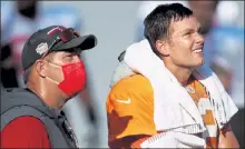  ?? DIRK SHADD / TAMPA BAY TIMES FILE ?? Tampa Bay Buccaneers general manager Jason Licht, left, talks with quarterbac­k Tom Brady during training camp in September 2020 at Raymond James Stadium in Tampa, Fla.