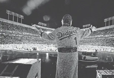  ?? PROVIDED BY BEN GIBSON ?? Elton John ends his concert at Dodger Stadium on Sunday in throwback attire.