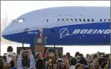  ?? SUSAN WALSH
/AP ?? The
Boeing 787 Dreamliner behind President Donald Trump consists of about 30 percent of foreign-made materials.