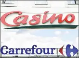  ??  ?? This combinatio­n of pictures created on Sept 24, shows the logo of French multinatio­nal group Casino (up) taken on July 28, 2010,and the logo of French retail giantCarre­four taken in Nantes, on Jan26, 2018.