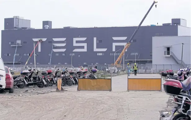  ?? REUTERS ?? A gigafactor­y of Tesla Inc is seen in Shanghai on October 18, 2019. Production at the factory is expected to begin by the end of the year.