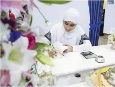  ?? Antonie Robertson / The National ?? Emirati author Aysha Al Naqbi debuted with Blue Moon at Abu Dhabi Internatio­nal Book Fair last year