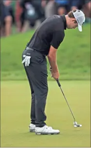  ?? Aaron Doster-USA TODAY Sports ?? Patrick Cantlay putts on 18th green during the first playoff hole during the final round of the Memorial Tournament golf tourney on Sunday.