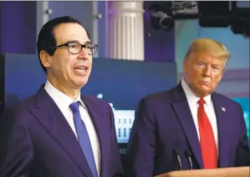  ?? Alex Brandon Associated Press ?? TREASURY Secretary Steven T. Mnuchin, shown with President Trump in April, said he would not disclose the names of small businesses receiving loans through the $600-billion Paycheck Protection Program.