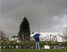  ?? CARLOS GONZALEZ — STAR TRIBUNE VIA AP, FILE ?? In this file photo, a rainbow appears over Prince’s Paisley Park estate near a memorial for the rock superstar in Chanhassen, Minn.