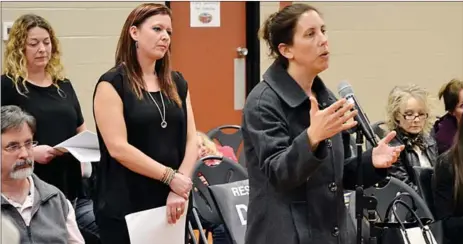  ?? JAMES MILLER/Westside Weekly ?? Parent Tara Walters addresses the Central Okanagan School Board, Wednesday evening at a meeting in Rutland. There will be a major reconfigur­ation of grades beginning this fall.