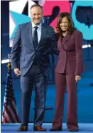  ?? CAROLYN KASTER/AP ?? Democratic vice presidenti­al candidate Sen. Kamala Harris is joined on stage by husband Doug Emhoff after her speech.