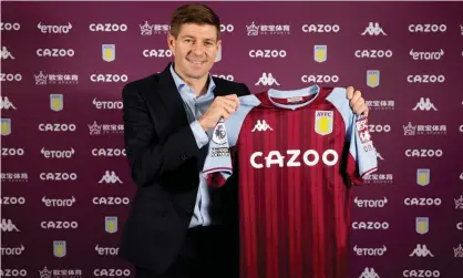  ?? Photograph: Neville Williams/Aston Villa FC/Getty Images ?? Steven Gerrard holds an Aston Villa shirt after his appointmen­t was announced on Thursday.