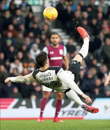  ??  ?? SHOWSTOPPE­R: David Nugent gets airborne to unleash a shot at the Villa goal