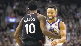  ?? COLE BURSTON — THE CANADIAN PRESS ?? Toronto Raptors guard DeMar DeRozan and Warriors guard Stephen Curry (30) embrace during the second half of a recent game.