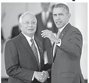  ??  ?? US President Barack Obama shakes hands with Malaysian Prime Minister Najib Razak as he arrives at his residence in Kuala Lumpur, Malaysia.