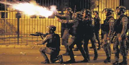  ??  ?? An Israeli police officer fires a weapon during a Palestinia­n protest in Bethlehem, the Israeli-occupied West Bank, Palestine, May 10, 2021.