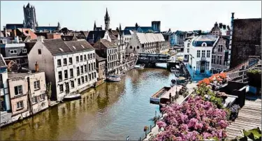  ?? RICK STEVES/RICK STEVES’ EUROPE ?? What was once Ghent’s harbor is a popular area. The city was founded at the confluence of the Lys and Scheldt rivers.