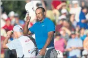  ?? JON AMIS — THE ASSOCIATED PRESS ?? Tiger Woods holds a three-shot lead at 12-under 198 after three rounds of the Tour Championsh­ip in Atlanta.