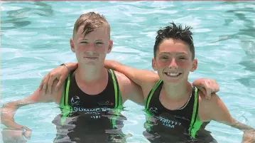  ?? ?? WE ARE IN THIS TOGETHER . . . Young Zimbabwean triathlete­s Zachary Summers (left) and Callum Smith (right) cool down after their final preparator­y race for the South African Youth Championsh­ips at Mount Pleasant Swimming Pool in Harare yesterday.