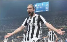  ?? — Reuters ?? Juventus’ Gonzalo Higuain celebrates scoring their third goal.