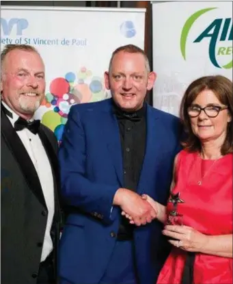  ??  ?? Vincent’s Dunleer. Mary Daly, Shop Manager is congratula­ted on the Team of the Year award by Peter Johnson, SVP Retail Regional Manager, North East & Midlands Region. with Dermot McGilloway SVP National Retail Developmen­t Manager (left)