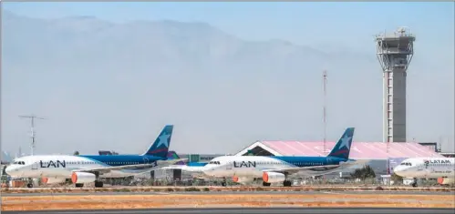  ?? (AFP) ?? Aircrafts of LATAM airline sit on the tarmac at Santiago Internatio­nal Airport, in Santiago recently.