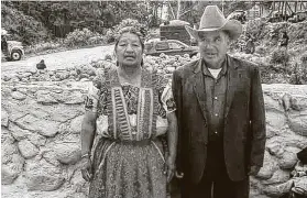  ??  ?? Juana Morales and Ricardo Sarat pose for a family photo in Salcajá, Guatemala. Their son Alfonso was admitted to an ICU Monday with a severe case of COVID-19.