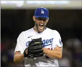  ?? Tribune News Service/getty Images ?? Starting pitcher Clayton Kershaw #22 of the Los Angeles Dodgers celebrates after the last out of the fourth inning against Atlanta Braves at Dodger Stadium on April 18.