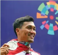  ?? CHANDRA SATWIKA/JAWA POS ?? BELUM PULIH: I Gusti Bagus Saputra ketika meraih medali perak Asian Games di Sirkuit Pulomas Internatio­nal, Jakarta (25/8/2018).