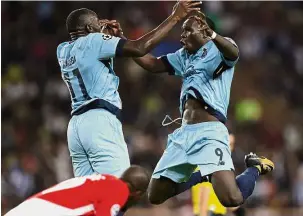  ??  ?? Flying high: Porto’s Vincent Aboubakar (right) celebratin­g with Moussa Marega after scoring against Monaco on Tuesday. Porto won 3- 0. — AFP