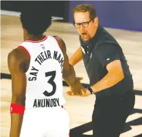  ?? KEVIN C. COX/GETTY IMAGES ?? Coach Nick Nurse celebrates with forward OG Anunoby during the Raptors’ 104-99 win over the Nets on Wednesday.