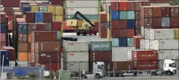  ?? MARTIN MEISSNER — THE ASSOCIATED PRESS ?? Containers are stored for export at a harbor in Duisburg, Germany, Monday.