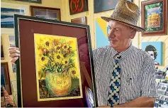  ?? ?? Yellow Art Gallery owner Richard Aslett with the winning piece, a take on Vincent van Gogh’s
Sunflowers.