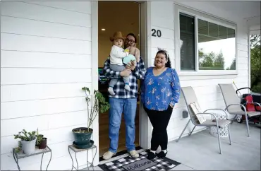  ?? PHOTOS BY SHAE HAMMOND — STAFF PHOTOGRAPH­ER ?? Gloria Prado, an administra­tive assistant with the Los Gatos Union School District, her husband, Leo Prado, and their son Mateo, 19months, have a two-bedroom unit in an affordable housing developmen­t for teachers and school staff in Los Gatos.