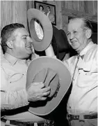  ??  ?? February 8, 1966: A cowboy’s nothing without his hat. Sonny Look, left, Guy Francis always have theirs.