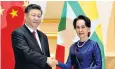  ??  ?? Xi Jinping is welcomed by Aung San Suu Kyi