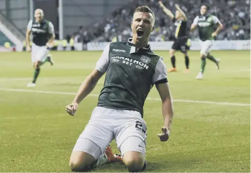  ??  ?? 0 Hibs’ Swiss striker Florian Kamberi celebrates his goal, which capped a comeback from two down to win 3-2 .