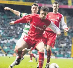  ??  ?? Big earner Ross Forsyth andf Stewart Devine hold off Celtic’s Scott McDonald back in January 2009