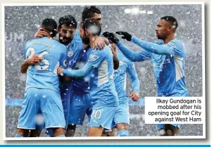  ?? ?? Ilkay Gundogan is mobbed after his opening goal for City against West Ham