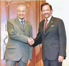  ??  ?? Dr Mahathir (left) with Sultan Hassanal Bolkiah after the conclusion of the Malaysia-Brunei 22nd Annual Leaders’ Consultati­on. — Bernama photo