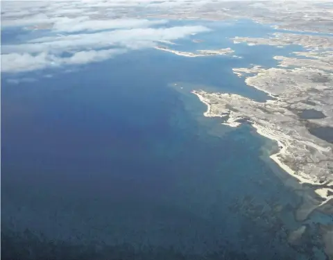  ?? THE CANADIAN PRESS FILES ?? Terror Bay where the sunken ship the HMS Terror lies, near Gjoa Haven Nunavut, is seen on Sept. 3. Ottawa has set aside nearly 60 square kilometres of seabed off the coast of Nunavut to keep looky-loos and scavengers away from one of Canada’s most...