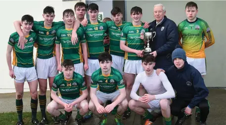  ??  ?? Kieran O’Donoghue, captain of the St Brendan’s College Killarney team, receives the Dubloe Cup from Christy Killeen at the John Mitchels GAA Complex. Photo by Domnick Walsh